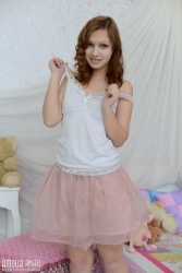 Smiling cutie on mattress   NakedTeen.photos