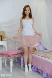 Smiling cutie on mattress   NakedTeen.photos